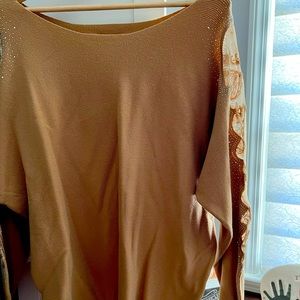 Worn once. Tan sweater with beautiful detail on the sleeves